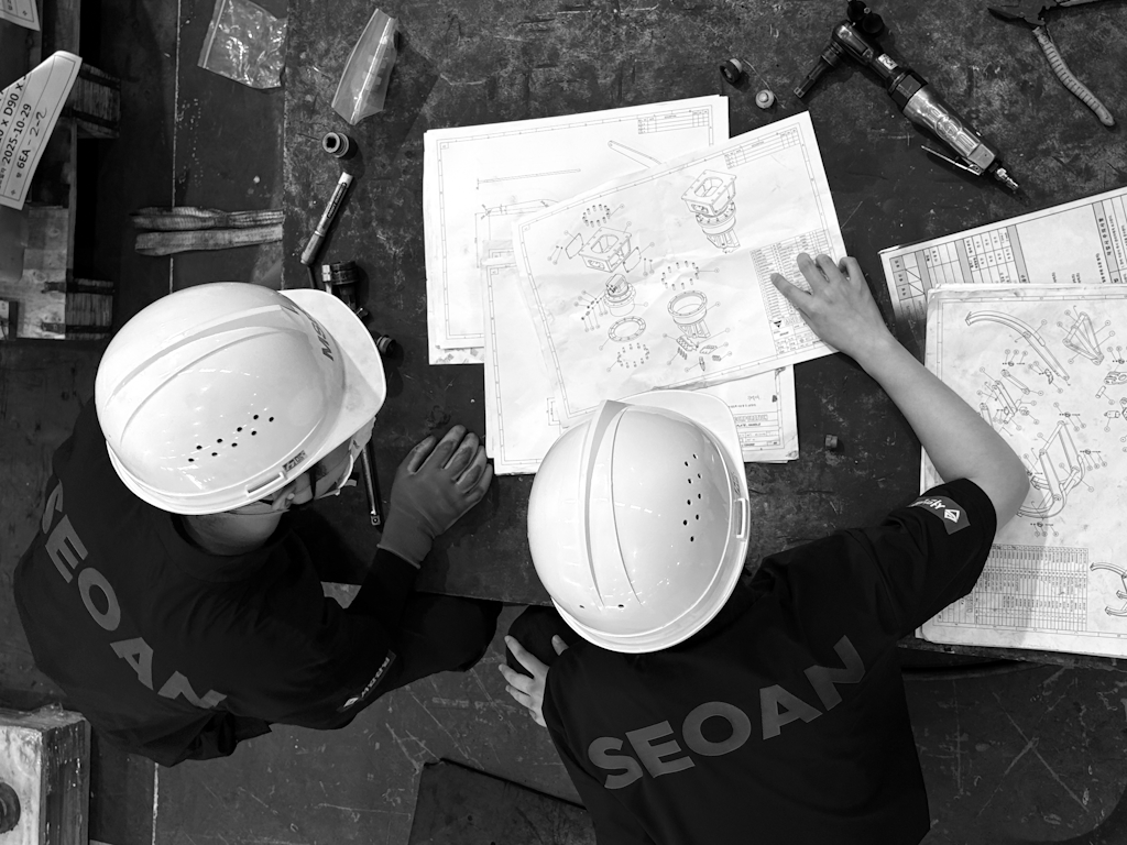 SEOAN team reviewing drawings