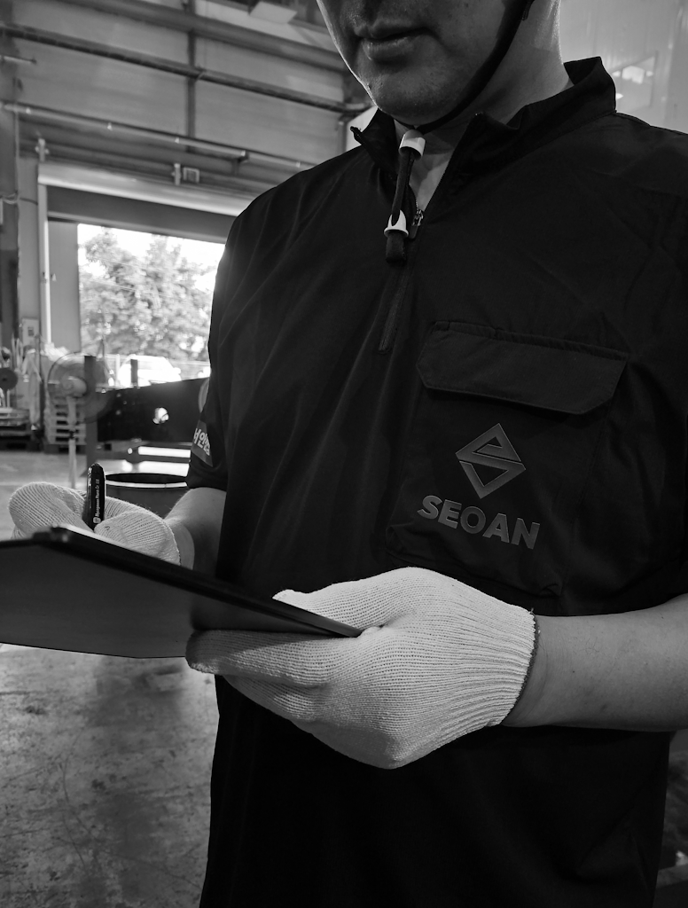 SEOAN worker checking a tablet